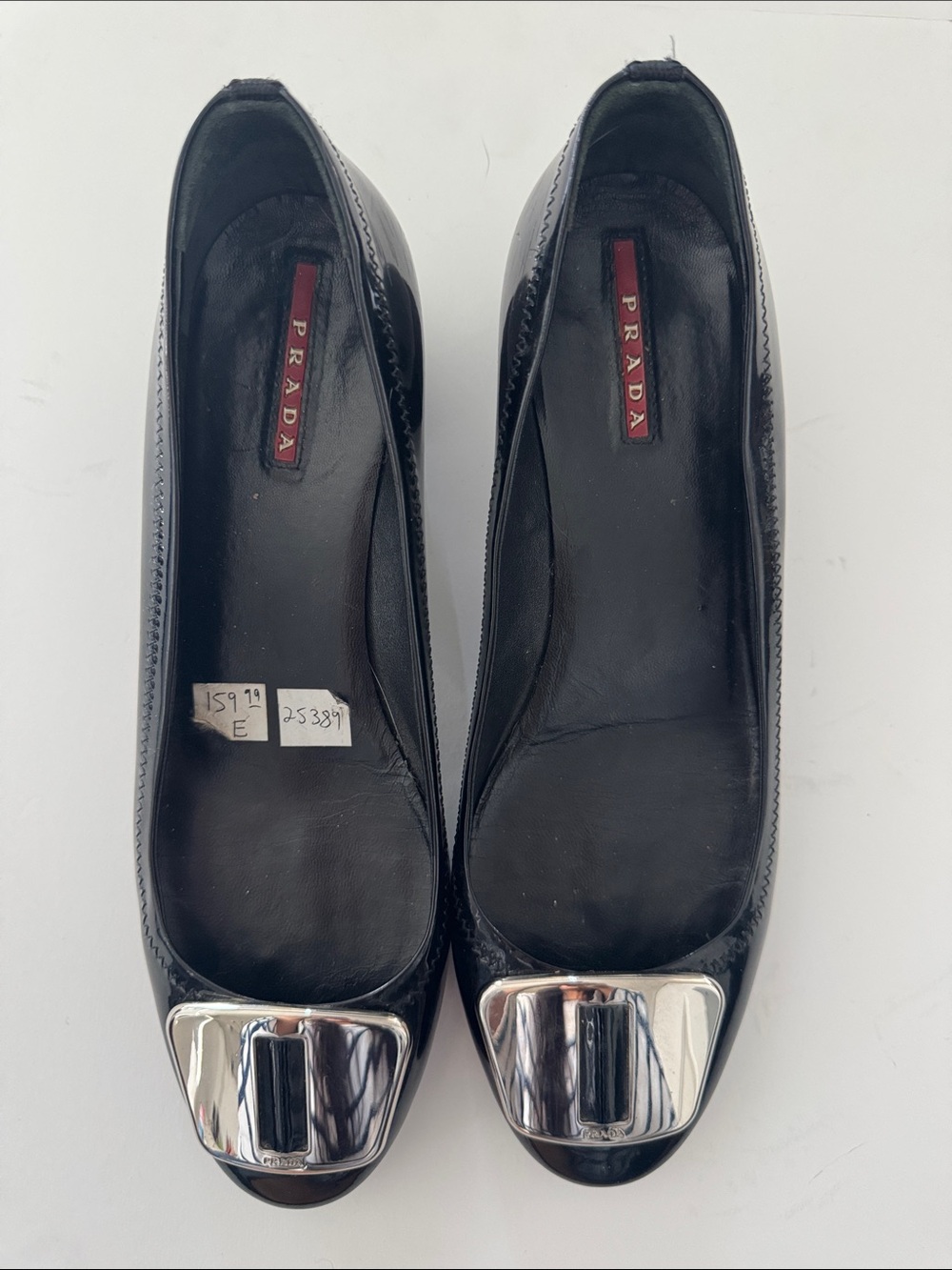 Prada Black Leather Flats with Silver Buckle Accents